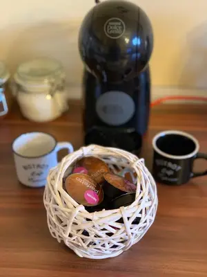 a basket of cookies on a table with a coffee maker at Ski-in & Ski-out, Apartman Filip - 30m from GONDOLA Brzeće in Kopaonik