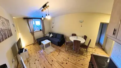 an overhead view of a living room with a couch and a table at Ski-in & Ski-out, Apartman Filip - 30m from GONDOLA Brzeće in Kopaonik