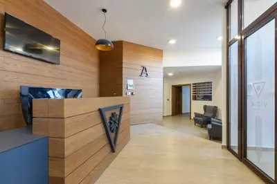 an office with a reception desk with a tv at Vidik Residence in Kopaonik