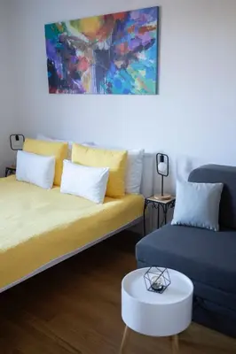 a living room with a couch and a table at Vidik Residence in Kopaonik