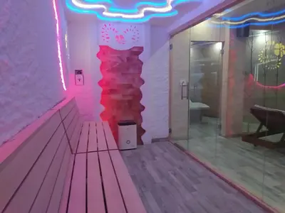 a room with a bowling alley with a red wall at Kopaonik Milmari Mili P75 in Kopaonik
