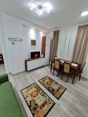 a living room with a table and a dining room at 