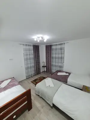 a room with two beds in a room at 