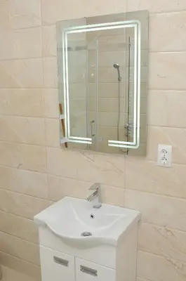a bathroom with a sink and a mirror at 