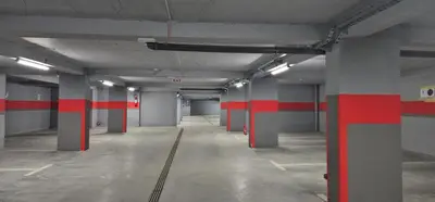 an empty parking garage with red stripes on the walls at Apt in the Sky - Kopaonik Kraljevi Čardaci in Kopaonik