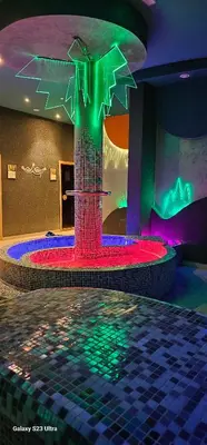 a room with a fountain in a room with lights at Apt in the Sky - Kopaonik Kraljevi Čardaci in Kopaonik