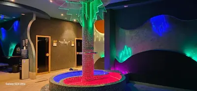 a room with a toy tree in a room with lights at Apt in the Sky - Kopaonik Kraljevi Čardaci in Kopaonik
