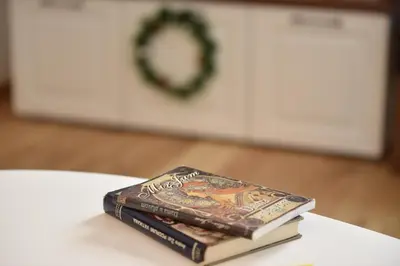 two books sitting on top of a table at Pegaz Premium Apartman Privatan Parking in Kopaonik