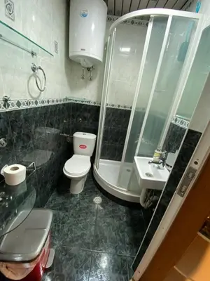 a bathroom with a toilet and a shower and a sink at Vila Plan 303 Kopaonik in Kopaonik