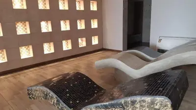 a group of chairs in a room with lights at Milmari N 20 Resort in Kopaonik