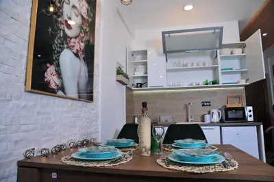 a table with blue plates on it in a kitchen at Milmari N 20 Resort in Kopaonik