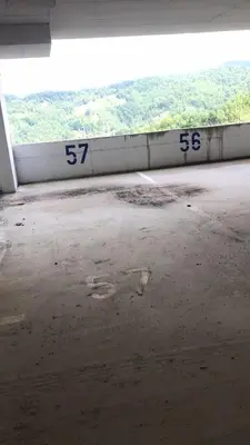 an empty room with numbers on the side of a building at Apartman “N 17”Milmari-Kopaonik in Kopaonik