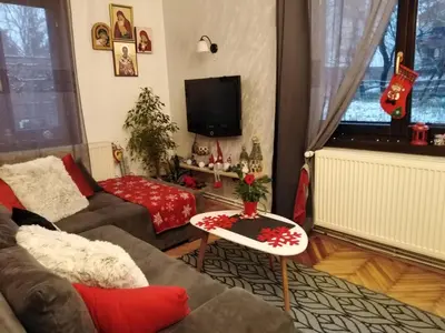 a living room with a couch and a table at Studio Sanja Knez in Soko Banja
