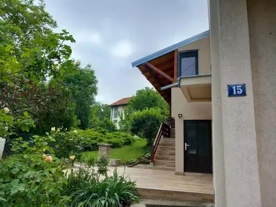 a house with a sign on the side of it at Studio Sanja Knez in Soko Banja