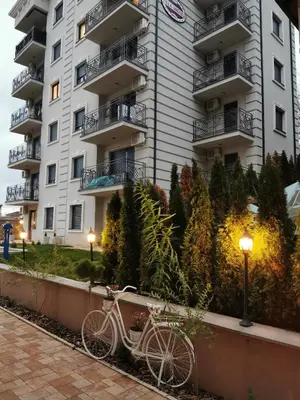 a bike parked in front of a building at Apartman Maximus in Vrnjačka Banja