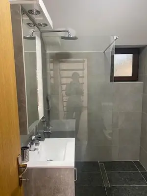a bathroom with a white sink and a mirror at Dvosobni apartmani KopaNiK, Kopaonik (Brzece) in Brzeće