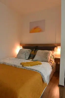 two beds in a bedroom with two pillows on them at Central Apartment in Ćuprija