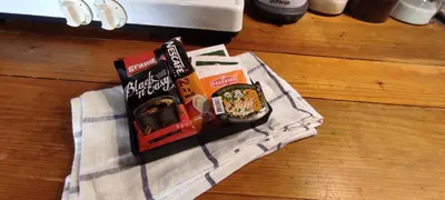 two packets of food sitting on top of a towel at Bele staze 85, GONDOLA, Brzeće in Brzeće
