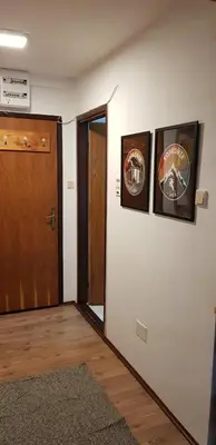 a room with three pictures on the wall and a door at Bele staze 85, GONDOLA, Brzeće in Brzeće