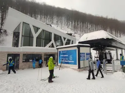 a group of people standing outside of a ski lodge at Bele staze 85, GONDOLA, Brzeće in Brzeće