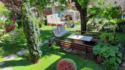 an overhead view of a park bench in a garden at Studio 2 Miljković in Soko Banja