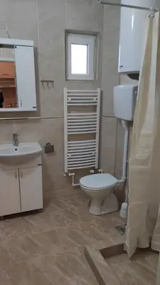 a bathroom with a toilet and a sink at Studio 2 Miljković in Soko Banja