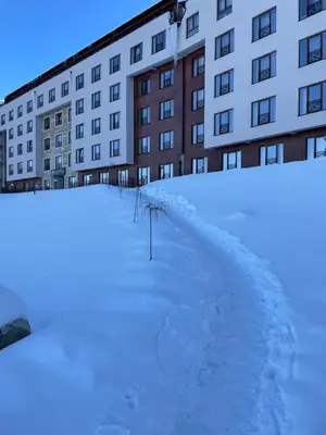 a pile of snow in front of a building at Mountain Bliss Residence - Milmari Spa & Wellness in Kopaonik