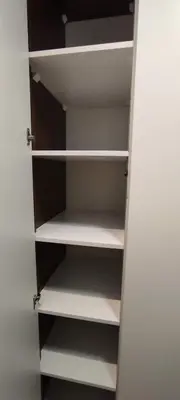 a closet with white shelves in a room at Zoned II Kopaonik - Studio Njegomir in Kopaonik