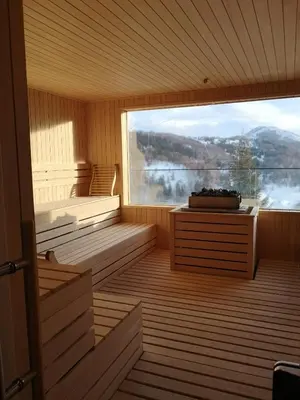 a sauna with a large window with a view at Zoned II Kopaonik - Studio Njegomir in Kopaonik
