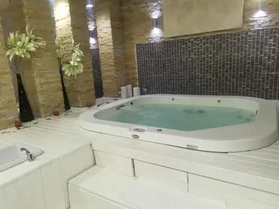 a large bath tub in a bathroom with two sinks at Zoned II Kopaonik - Studio Njegomir in Kopaonik