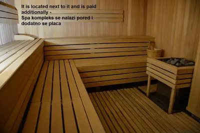 a sauna with a wooden tub with the words it is located next to it at Apartman Ema BIG 64m2-duplex Kopaonik in Kopaonik