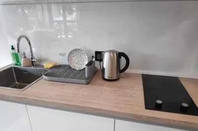 a kitchen counter with a coffee pot and a tea kettle at Mountain View 19 Zoned II Kopaonik in Kopaonik