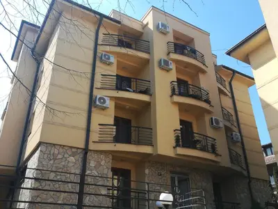 a building with balconies on the side of it at Apartman 2M Lux in Vrnjačka Banja