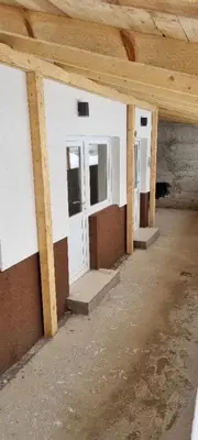 an empty room with a white door in a building at Iznad oblaka B02 in Kopaonik