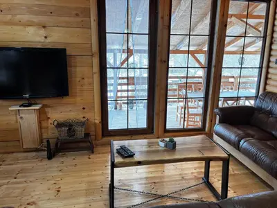 a living room with a couch and a coffee table at Lozanski ambar in Boljevac