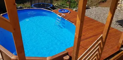 an overhead view of a swimming pool on a wooden deck at Lozanski ambar in Boljevac