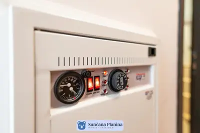 a gas pressure gauge on the side of a appliance at Sunčana Planina - Apartmani Wombat in Kopaonik