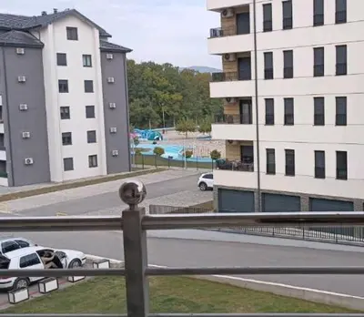 a view of a city street with buildings and cars at Apolon Spa in Vrnjačka Banja