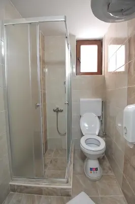 a bathroom with a shower and a toilet at Kopaonik Apartman Sanja in Kopaonik