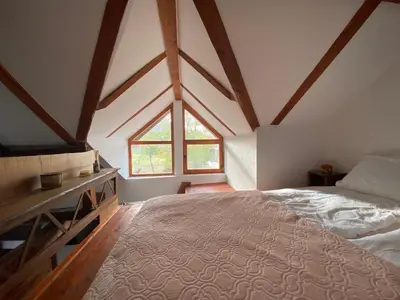 a bedroom with a large bed and a window at Mitrović in Boljevac