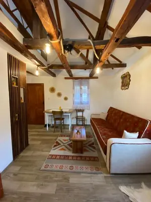 a living room with a couch and a table at Mitrović in Boljevac