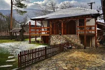 a small house with a fence in front of it at Mitrović in Boljevac