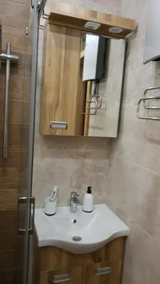 a bathroom with a sink and a mirror at Apartment Nadja in Kopaonik