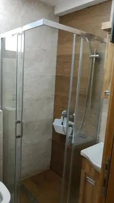 a bathroom with a shower and a sink at Apartment Nadja in Kopaonik