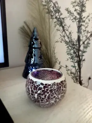 a bowl sitting on a table next to a vase at KopStar Apartment Kopaonik G2 in Kopaonik