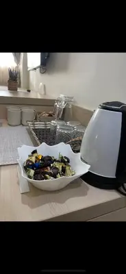 a plate of food on a counter next to a sink at Apartmani Dušica Konaci Kopaonik in Kopaonik