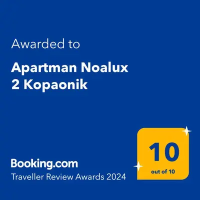 a yellow box with the text awarded to aprilan novuk k at Apartman Noalux 2 Kopaonik in Kopaonik