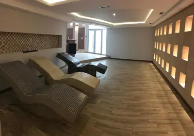 a lobby with couches and chairs in a room at Apartman Premier 32 Milmari in Kopaonik