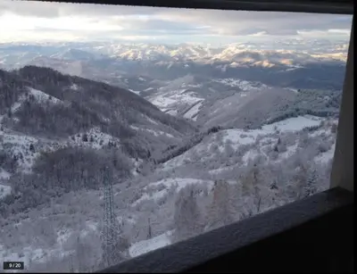 a view of a snowy mountain range from an airplane at Apartman Horizont Kop in Kopaonik