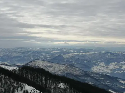 a view of a mountain range with snow at Apartman Horizont Kop in Kopaonik